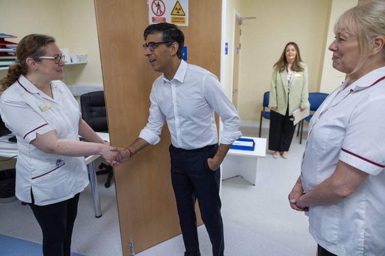 11/04/2024. Woking, United Kingdom. The Prime Minister Rishi Sunak visits Woking Community Hospital where he met staff and spoke with a patient having a bone diagnostic test in the Community Diagnostic Centre. Picture by Simon Walker / No 10 Downing Street