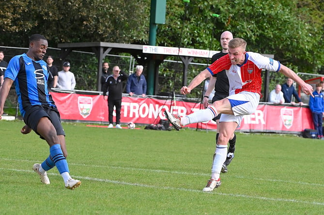 Zac Hawker shoots for Knaphill v Colliers Wood United, April 13th 2024.