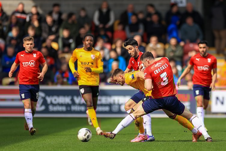 Action from Woking's 2-0 defeat at York City on Saturday (Photo: Phil Fiddes)