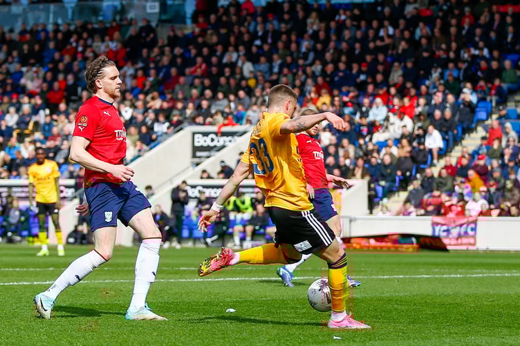 Action from Woking's 2-0 defeat at York City on Saturday (Photo: Phil Fiddes)