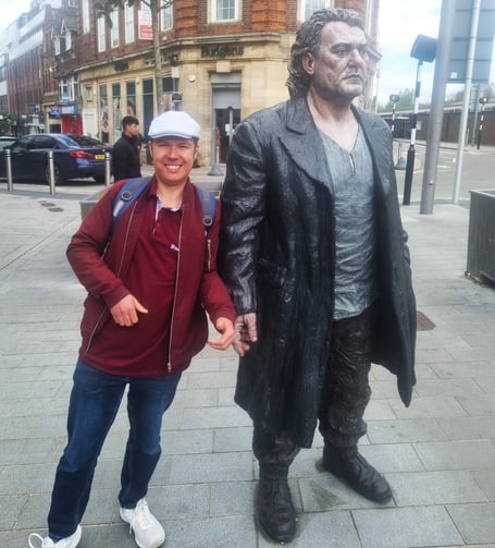 Jon Andrews's friend Alex with one of the Sean Henry statues in Woking town centre