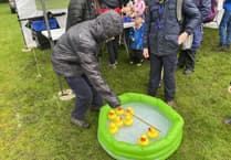 Horsell Scouts and Guides defy rain at Wheatsheaf May Fayre