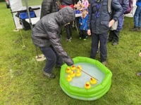 Scouts and Guides shrug off rain at May Fayre