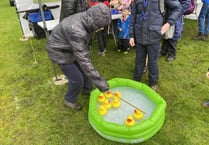 Scouts and Guides shrug off rain at May Fayre