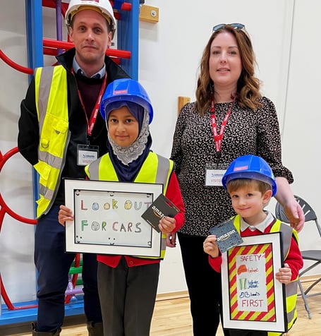 Tooba Syed and Henry Jobson from Lakeside Primary School, in Deepcut with Matt Jenkins, Bewley Homes health and safety manager and Chloe Willman, Bewley's head of customer experience