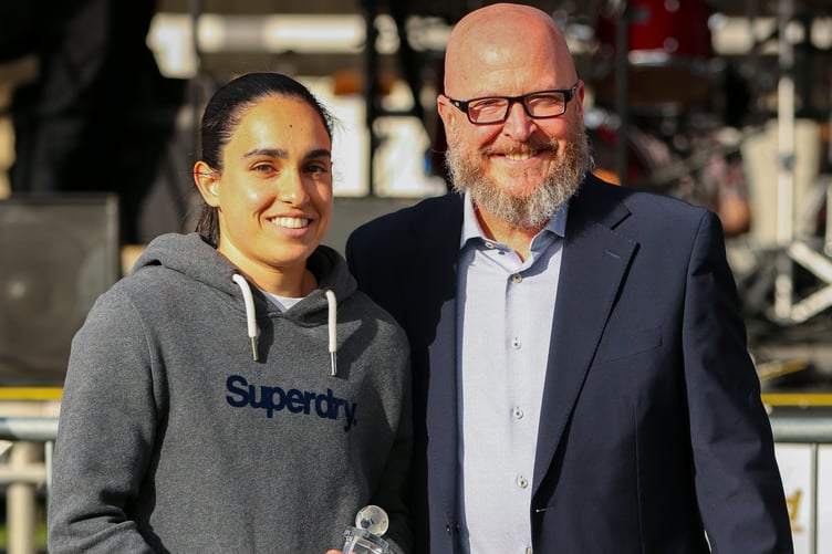Woking women's team manager's player of the season Efrosyni Theocharous (left) receives her award from Woking chief executive John Katz (Photo: Phil Fiddes)