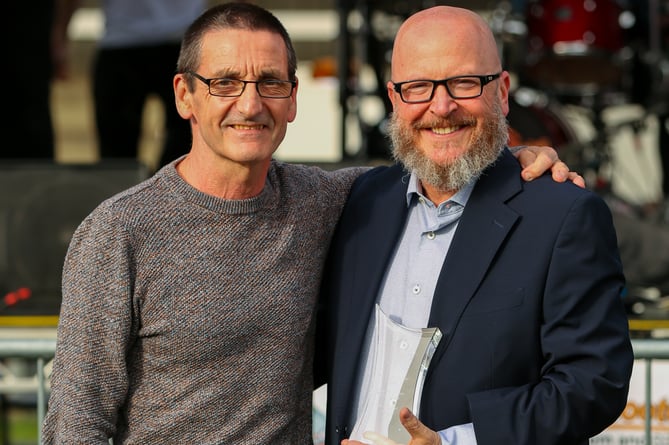 Volunteer of the year Phil Marlow (left) receives his award from Woking chief executive John Katz (Photo: Phil Fiddes)