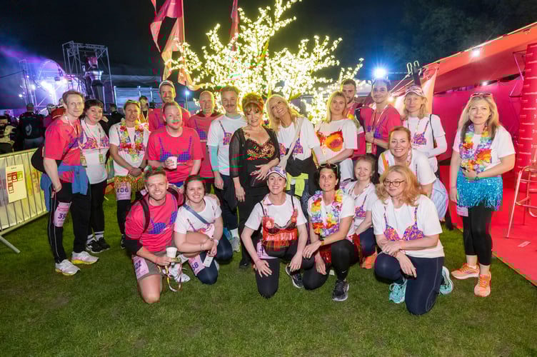 Walk the Walk Ambassador and EastEnders actress Harriet Thorpe, centre, flanked by Hollyoaks actor David Ames and TV presenter Gaby Roslin with fellow EastEnders actresses Natalie Cassidy and Heather Peace, kneeling centre.
