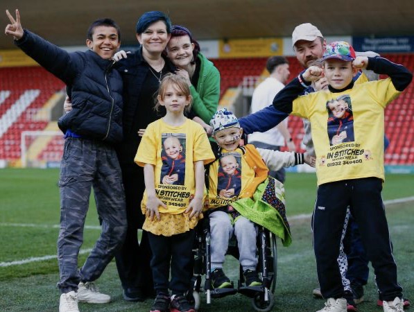 Cain Critcher with his mum Shaney and dad Andy with brothers and sisters, from left, Riley, Elise, Caitlyn and Romeo
