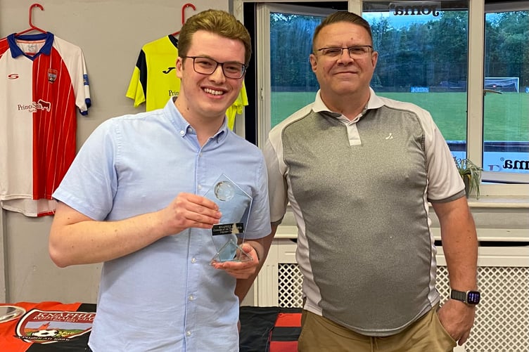 Matthew Fance (left) receives the Clubman of the Year award from chairman Chris Drane (Photo: Knaphill FC)