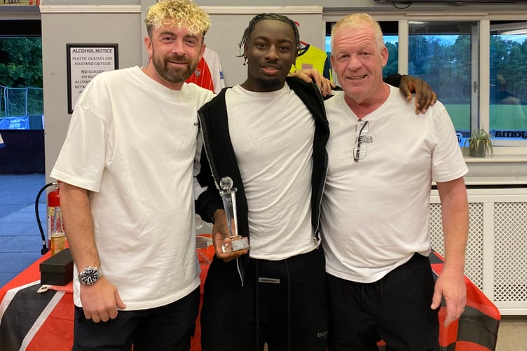 Jose Sani (centre) receives the top goalscorer award from former joint-managers Jamie Daltrey (left) and John Cook (right) (Photo: Knaphill FC)