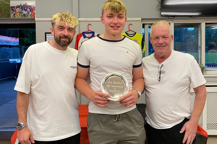 Jos Barker (centre) receives an 100 appearances award from former joint-managers John Cook (right) and Jamie Daltrey (left) (Photo: Knaphill FC)