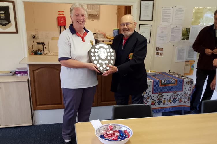 President Roberts Hills presents the shield to captain Angela Boarer