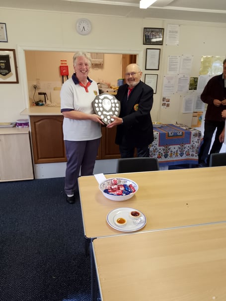 President Roberts Hills presents the shield to captain Angela Boarer