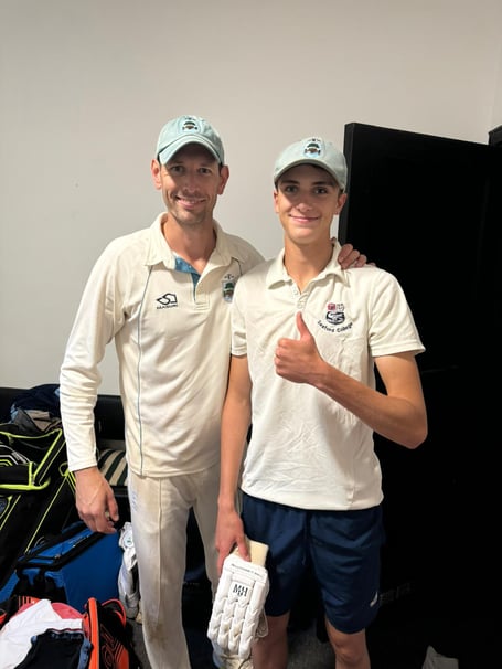 Tilford captain George Ellis (left) and 15-year old John Barran after Tilford's 77-run win against Frimley