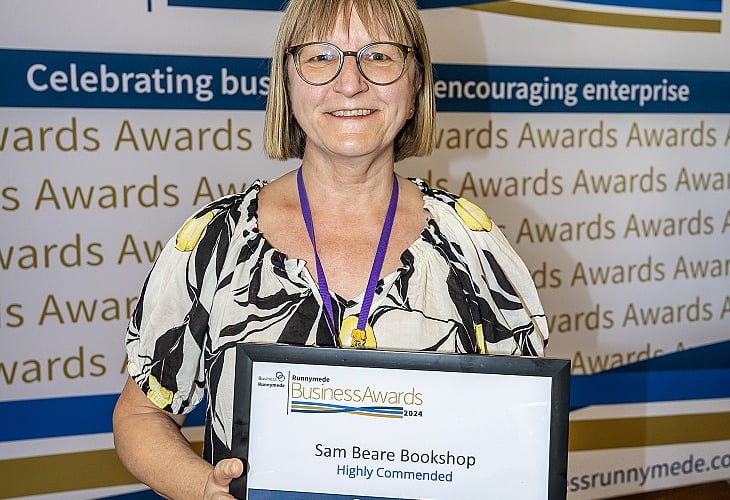 Anya holding the shops' 'Highly Commended' Growth Award