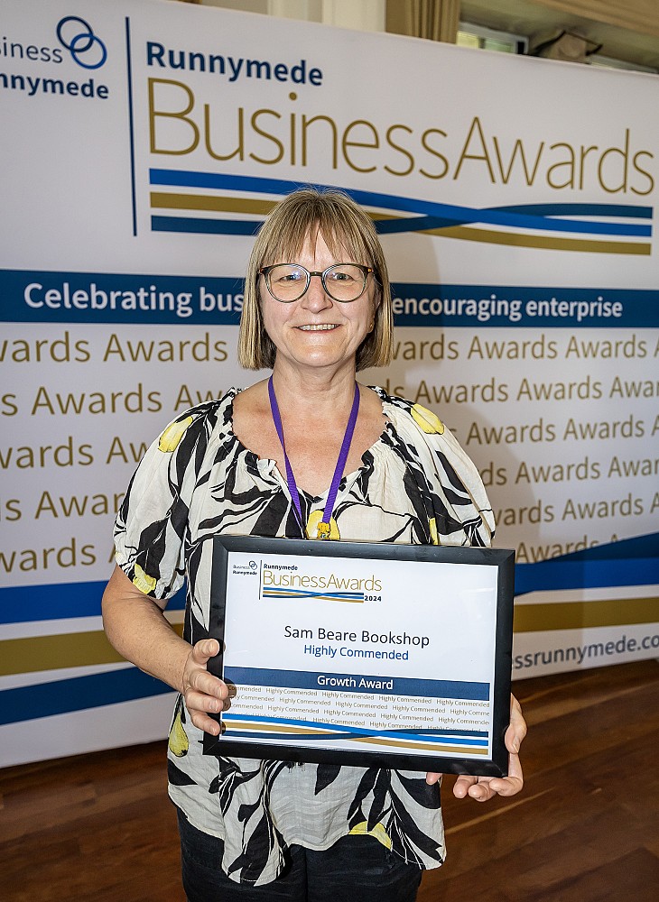 Anya holding the shops' 'Highly Commended' Growth Award