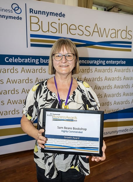 Anya holding the shops' 'Highly Commended' Growth Award