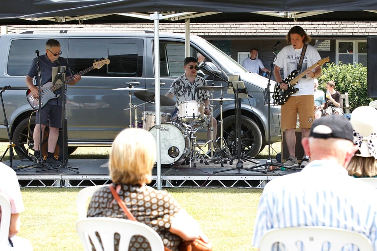 The three-piece band Weydown, performing at the fete on the sponsored stage (Vistry SE)
