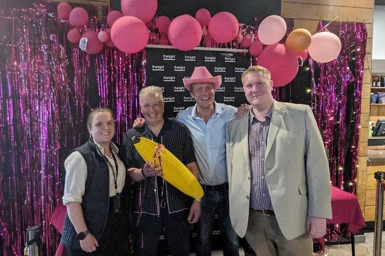 In happier times, Johnathan Wilson (right) with friends and colleagues 
