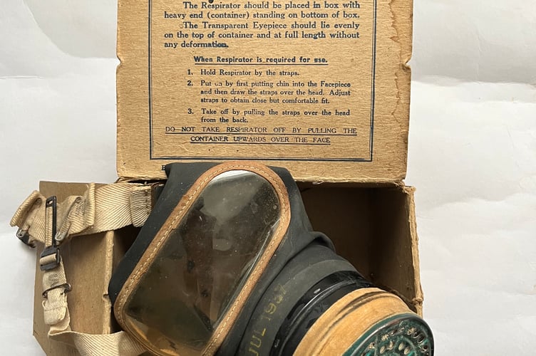 Wartime gas mask with its original cardboard box