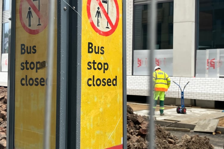 Sign for a suspended bus stop while development work takes place
