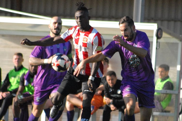 Guildford City's Manny Acheampong competes for possession against Tooting & Mitcham United (Photo: Chris Pegman)