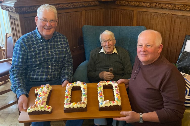 Reg with his sons Neil and Kevin, far right 