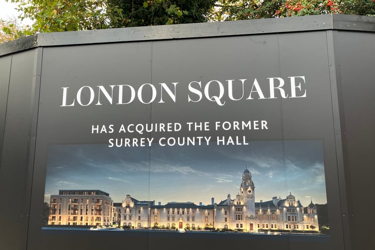 A construction board bordering the former Surrey County Hall property in Kingston.