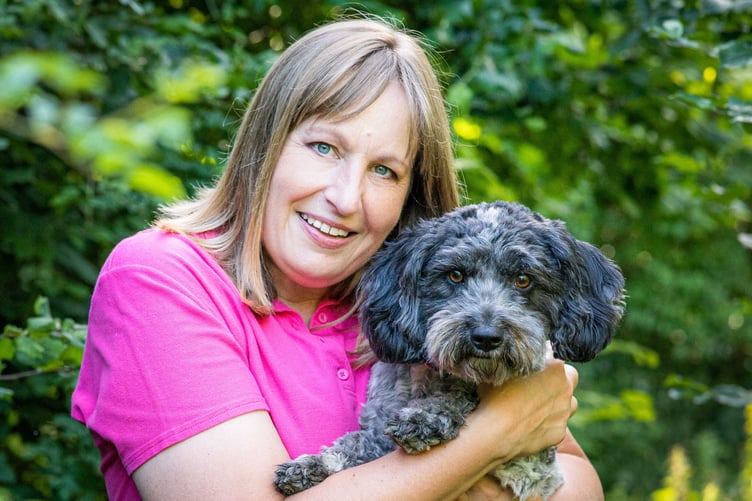 Jo Sellers with her dog Reba. Photo released November 13 2024. A woman facing a £17k vet bill after her beloved pooch broke their neck in a freak accident is warning dog owners to check their pet insurance policies.Jo Sellers, 54, was left horrified after her nine-year-old dog Reba accidentally ran into a tree in the garden and was found lying lifeless beneath it.Ms Sellers raced the Cocker Spaniel and Bichon Frisé cross to her local vets where she was given the devastating news that Reba had broke her C3 vertebra. Despite having insurance for her dog, Ms Sellers has been left with a vet bill of £17k and her insurance only covers a third of it.