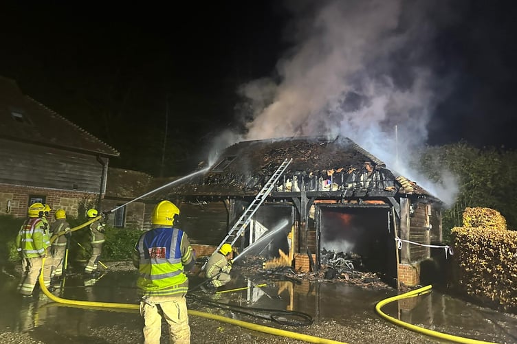 Firefighters from Surrey and Hampshire extinguish the house fire in Churt on November 15 2024