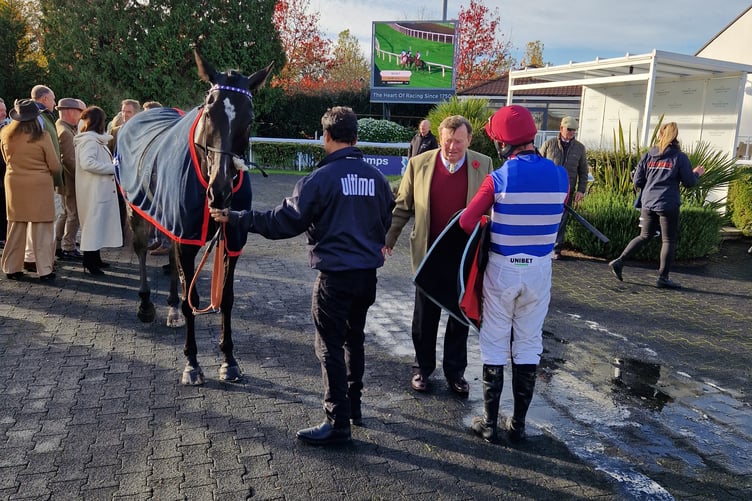 Califet En Vol in the winners' enclosure at Kempton Park with trainer Nicky Henderson and jockey Nico de Boinville (Photo: Peter Moore)