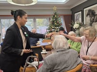 University students spread festive cheer at local care home