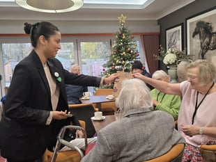 University students spread festive cheer at local care home