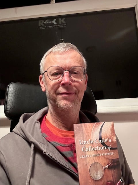 Pete Frost with his short story book