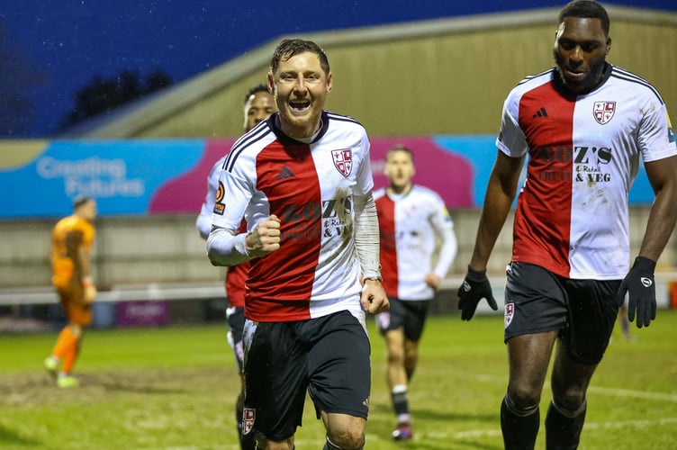 Harry Beautyman celebrates after firing Woking ahead from the penalty spot (Photo: Phil Fiddes)
