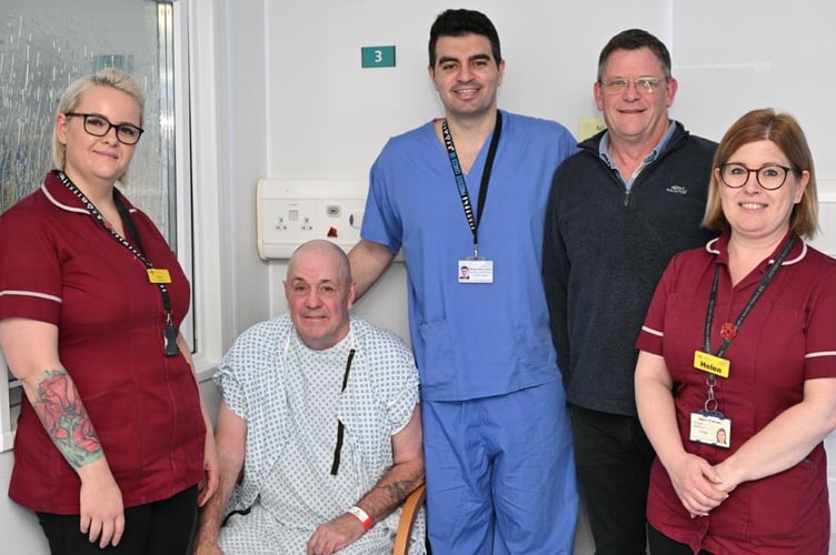 Keith Powell with brother Alan and medical staff at Royal Surrey County Hospital. Photo released January 19 2025.Two brothers received life-saving prostate cancer treatment within months of each other after a joke on a lad's holiday prompted them to take a test. Keith Powell, 68, underwent a radical prostatectomy just months after his younger brother, Alan, 66, had the same operation. The brothers even underwent their surgeries at the same hospital in Surrey with the same surgeon - and say they feel lucky to have caught the cancer before it spread. Retired gas and heating engineer Alan decided to get tested after a chance remark about the number of times 'men of a certain age' go to the toilet on a lad's holiday made him think.