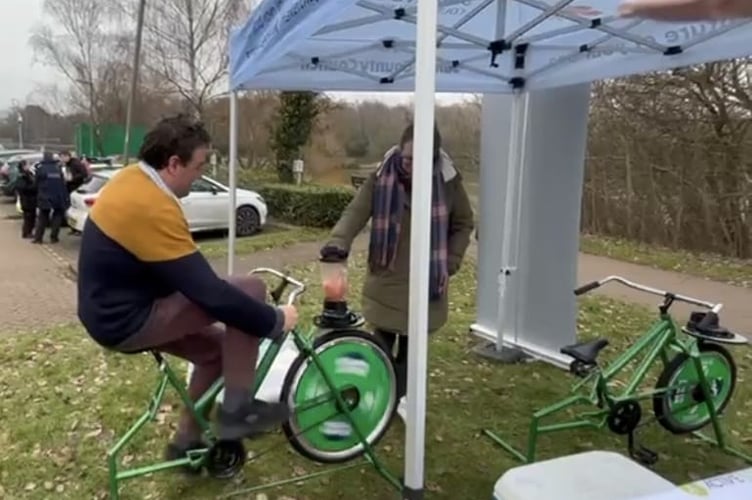 Jon Andrews on smoothie bike at Wellbeing Fest in Goldsworth Park