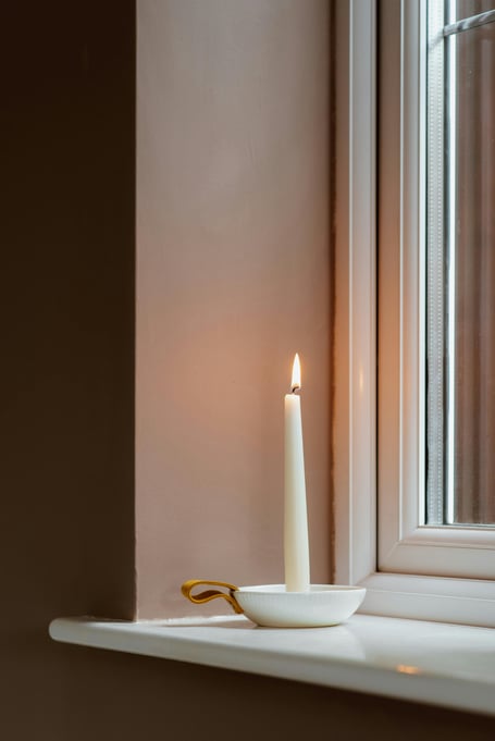 Candle on a window sill 