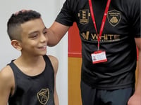 Woking boxing prodigy earns first amateur win