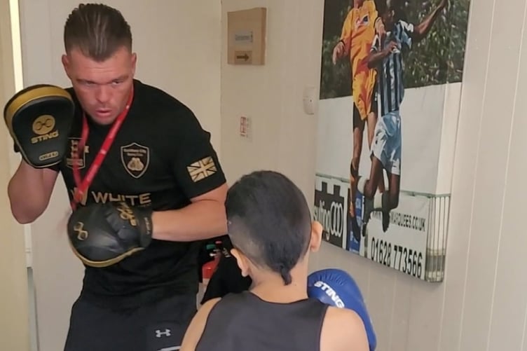 Ayub Mumin takes on pad work with coach Darren Codona