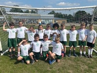 Horsell Village School lift football trophy