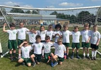 Horsell Village School lift football trophy