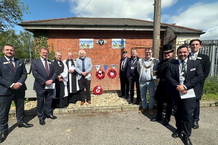Community and railway representatives unveil the new memorial plaque at Haslemere Station signal box, commemorating Southern Railway workers who lost their lives in WWII