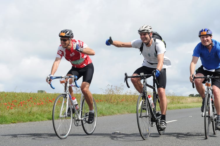 From left, Ed, Charlie and James cycling from London to Brighton in 2011