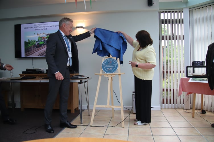 The commemorative plaque unveiled at Woking Homes, marking 140 years of service to the railway community