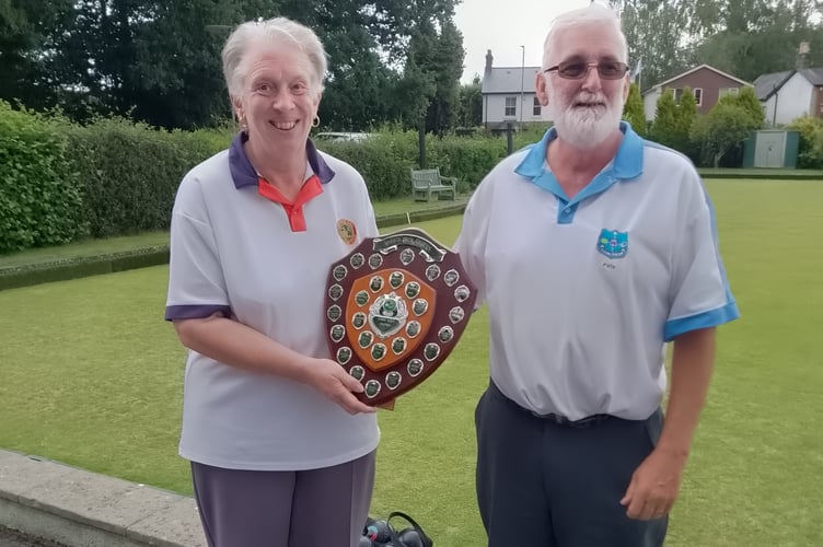 Angela Boarer receives the shield from Westfield's Peter Collier
