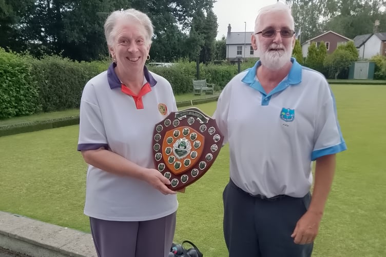 Angela Boarer receives the shield from Westfield's Peter Collier