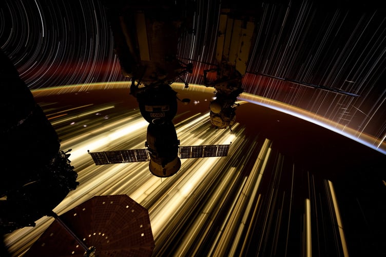 Starlink satellites are featured in this file photo (Dec 2024) taken by NASA astronaut Don Pettit from the International Space Station (ISS). He said: "This one shows atmospheric airglow, yellow-green at 120km and the fainter upper red at 400km, star trails moving in arcs on the left and straight lines on the right, Starlink satellites flashing sunlight off their solar panel, the Cygnus cargo vehicle (left), my Soyuz vehicle (center), and the Russian laboratory module MLM (right)."     An astronaut has shared the jaw-dropping view from his workplace window - aboard the International Space Station (ISS). American spaceman Don Pettit used long exposure camera techniques to shoot a trio of images looking out a window on the SpaceX Dragon crew spacecraft attached to the ISS. His pictures show the Pacific Ocean as viewed off the coasts of New Zealand, Australia and also Mexico. Another image shows Starlink satellites flashing sunlight off their solar panels and atmospheric airglow above Earth.        British researchers are working to solve the problem of Elon Musk's reflective satellites - by painting them black. A new partnership between Surrey NanoSystems and the University of Surrey is aiming to tackle the growing problem, a major concern for astronomers worldwide. Their latest innovation, Vantablack 310, is a super-black coating designed to dramatically reduce the glare from satellites that interferes with astronomical observations. Only 2% of incoming light is reflected by the surface after product is applied, while the remaining 98% is absorbed. More than 8,000 low Earth orbit (LEO) satellites already orbit Earth and projections estimate a rise to 60,000 by 2030, partly driven by the development of mega-constellations.