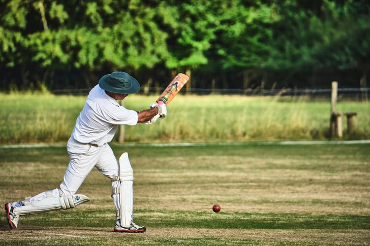 Right-handed batsman driving through the on side.